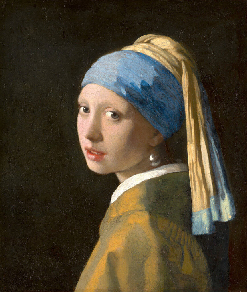 Ragazza con l’orecchino di perla di Johannes Vermeer, giovane con turbante blu e giallo e grande orecchino di perla su fondo scuro.